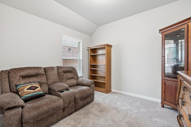 living room with light carpet and vaulted ceiling