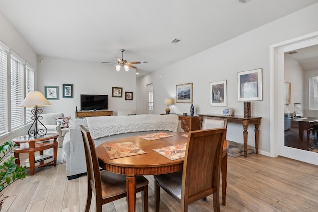 dining space featuring light hardwood / wood-style flooring and ceiling fan