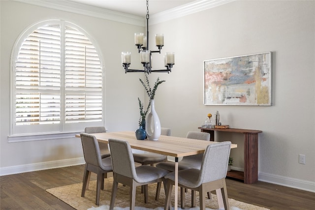 dining space featuring a notable chandelier, dark hardwood / wood-style flooring, and ornamental molding