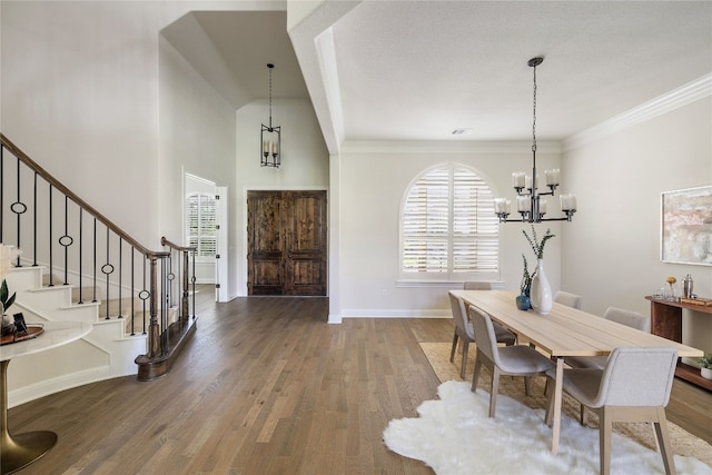 dining room with a chandelier and hardwood / wood-style flooring