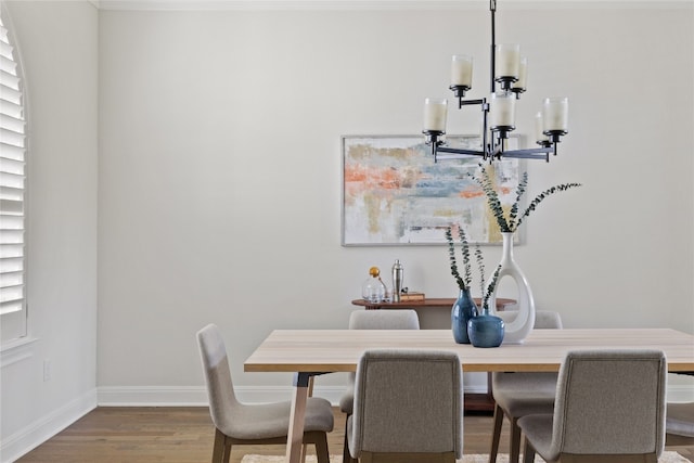 dining room with an inviting chandelier and hardwood / wood-style floors