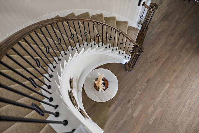 stairway featuring hardwood / wood-style flooring