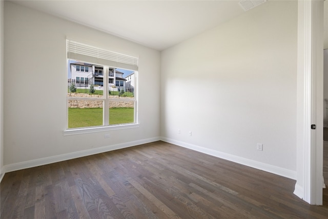 unfurnished room with dark hardwood / wood-style floors