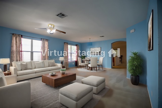 living room featuring ceiling fan and carpet floors