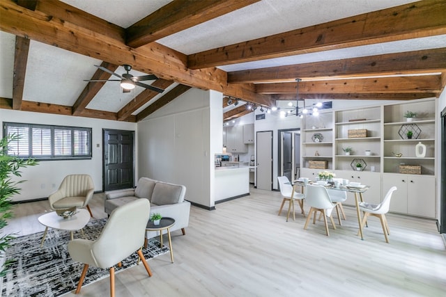 dining area featuring ceiling fan, vaulted ceiling with beams, and light hardwood / wood-style flooring