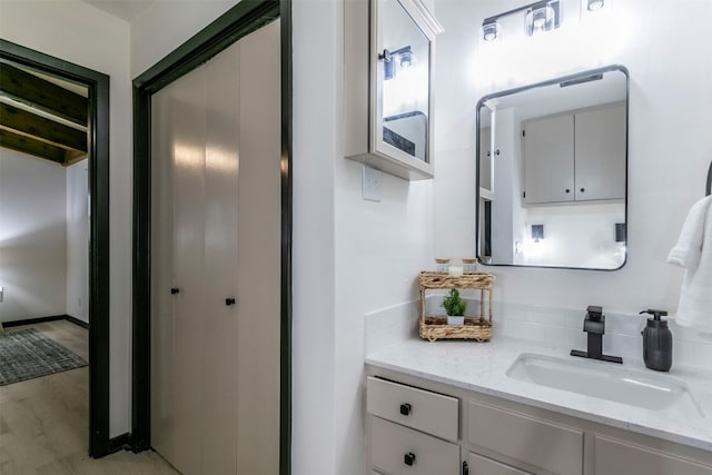 bathroom with vanity and hardwood / wood-style floors