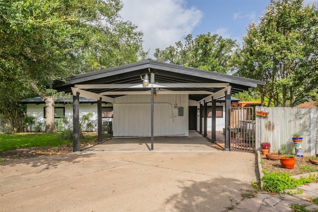 view of parking / parking lot featuring a carport