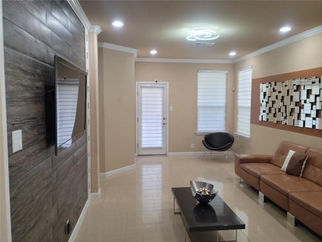 living room featuring light tile patterned floors and ornamental molding