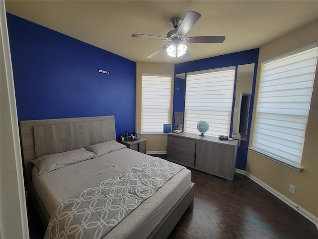 bedroom featuring dark wood-type flooring and ceiling fan