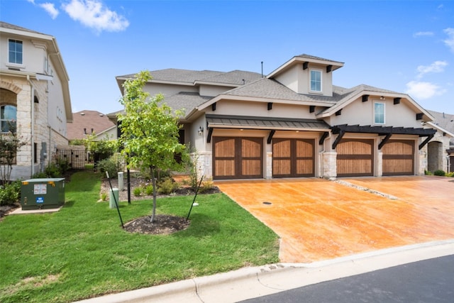 view of front of house with a front lawn and a garage