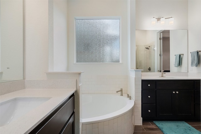 bathroom with vanity and plus walk in shower