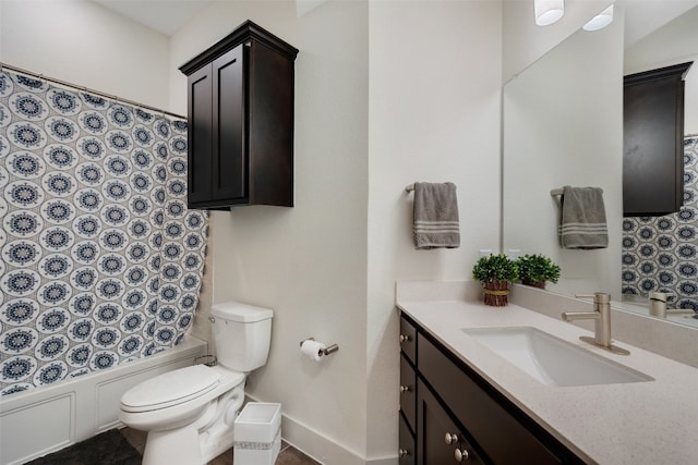 full bathroom with vanity, shower / bathtub combination with curtain, and toilet