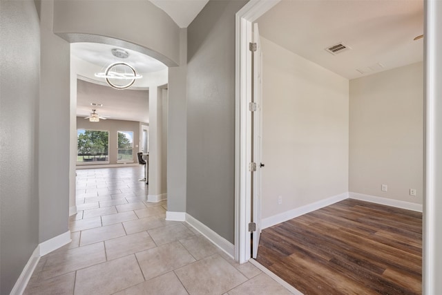 corridor with light hardwood / wood-style flooring