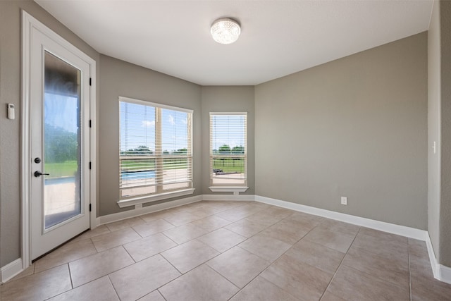 view of tiled spare room