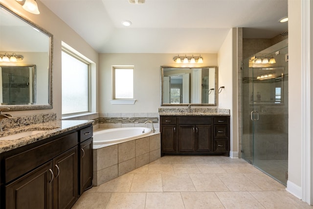 bathroom with vanity, independent shower and bath, and tile patterned flooring