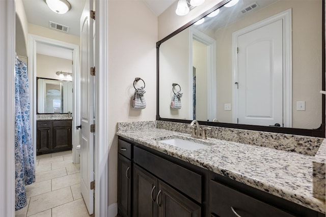 bathroom featuring vanity and tile patterned flooring