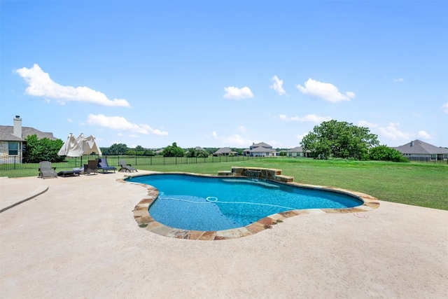 view of pool with a patio area and a lawn