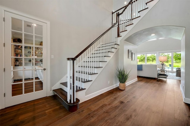 stairs with hardwood / wood-style flooring