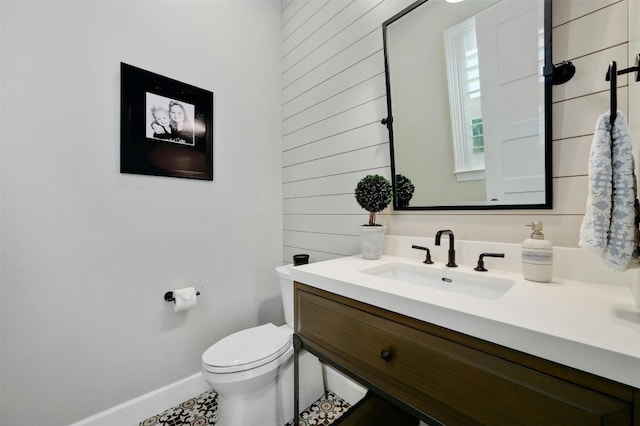 bathroom with vanity, toilet, and tile patterned flooring