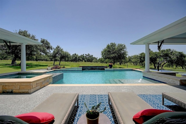 view of swimming pool featuring an in ground hot tub, a yard, and a patio area