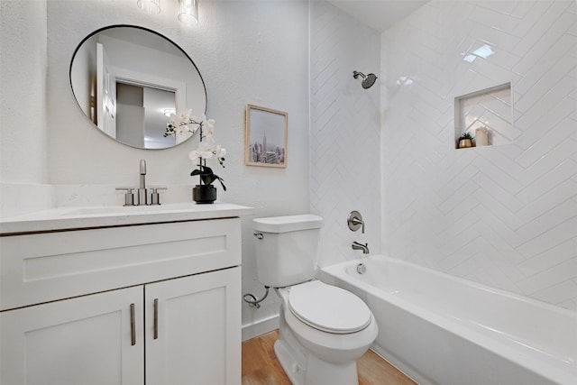 full bathroom featuring tiled shower / bath combo, vanity, toilet, and wood-type flooring