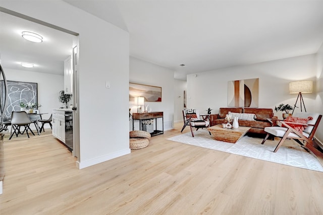 living room with light hardwood / wood-style floors