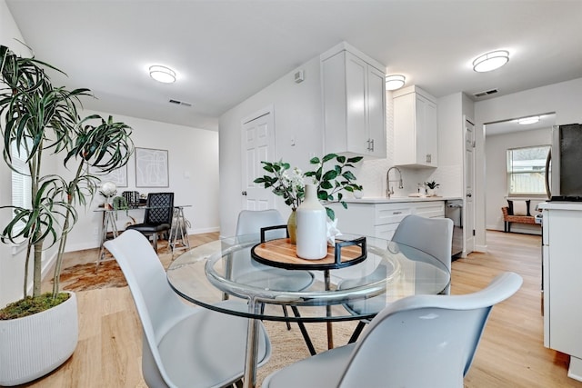 dining space featuring light hardwood / wood-style flooring