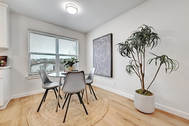 dining room with light wood-type flooring