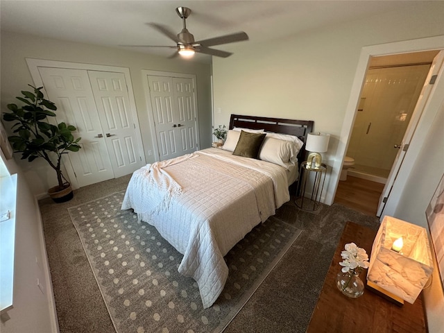 carpeted bedroom featuring ceiling fan and multiple closets