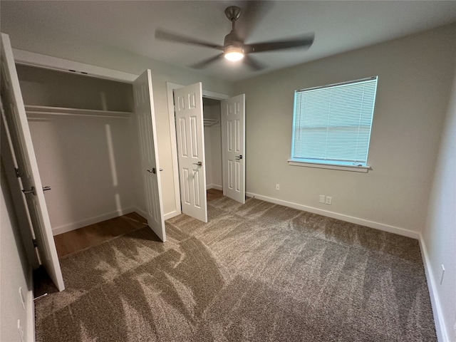 unfurnished bedroom with ceiling fan, a closet, and carpet floors