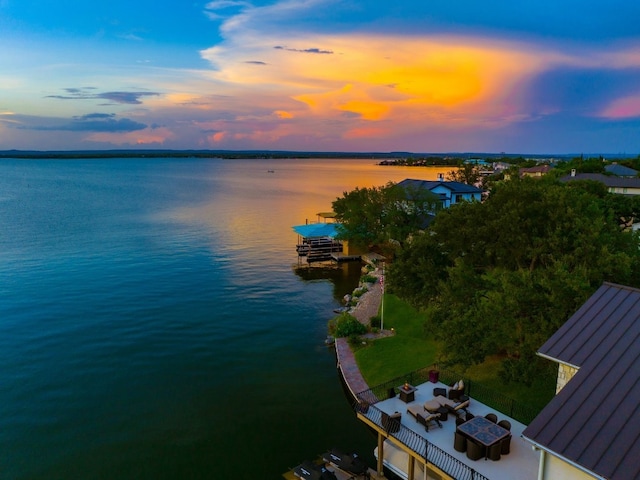 aerial view at dusk with a water view