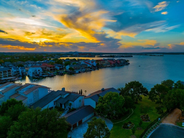 aerial view at dusk with a water view