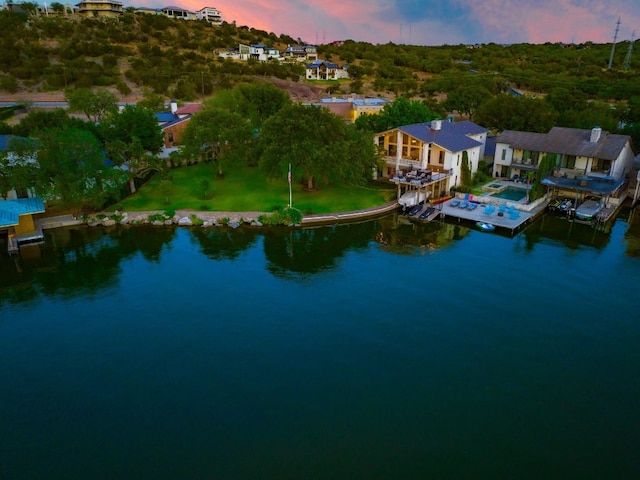 aerial view at dusk with a water view