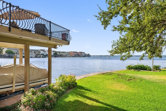 exterior space featuring a water view and a yard