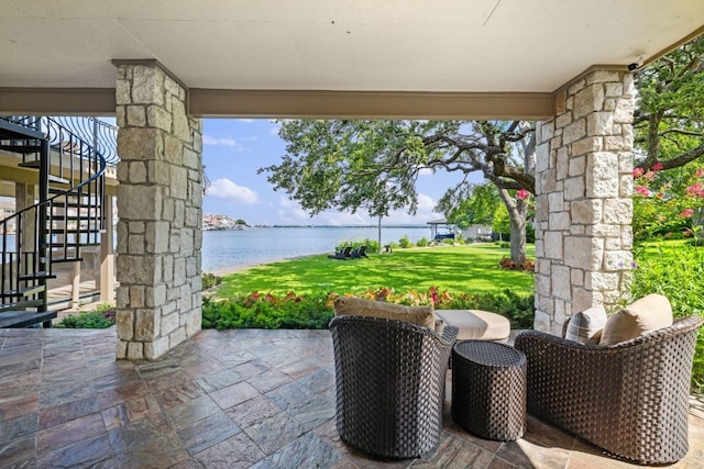 view of patio / terrace with a water view