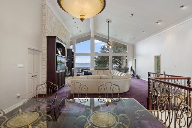 dining area featuring crown molding, ceiling fan, beamed ceiling, carpet, and high vaulted ceiling