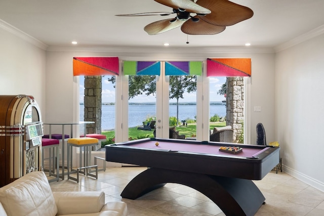 game room with a water view, billiards, light tile patterned floors, and ceiling fan