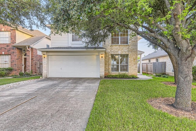 view of front of house featuring a garage and a front lawn