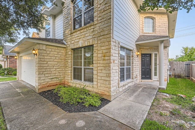 view of side of property with a garage