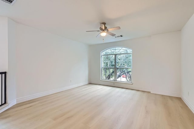 spare room featuring ceiling fan and light wood-type flooring