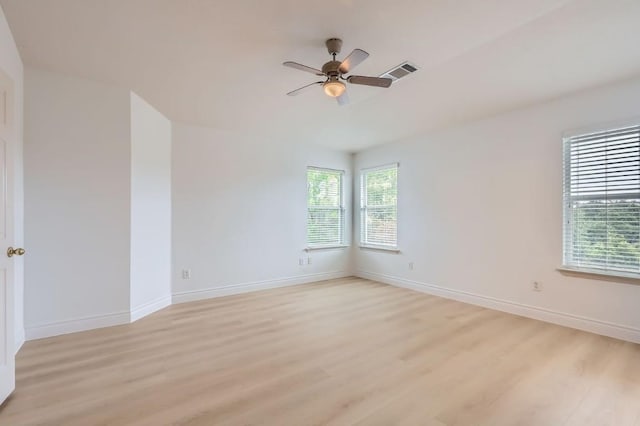 unfurnished room with ceiling fan and light wood-type flooring