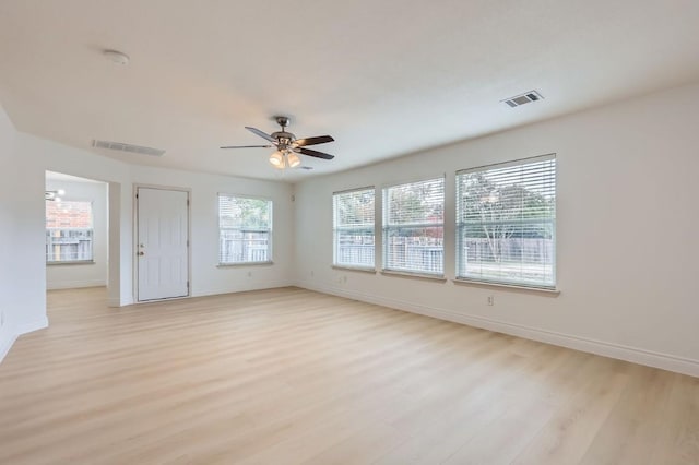 unfurnished room featuring ceiling fan and light wood-type flooring