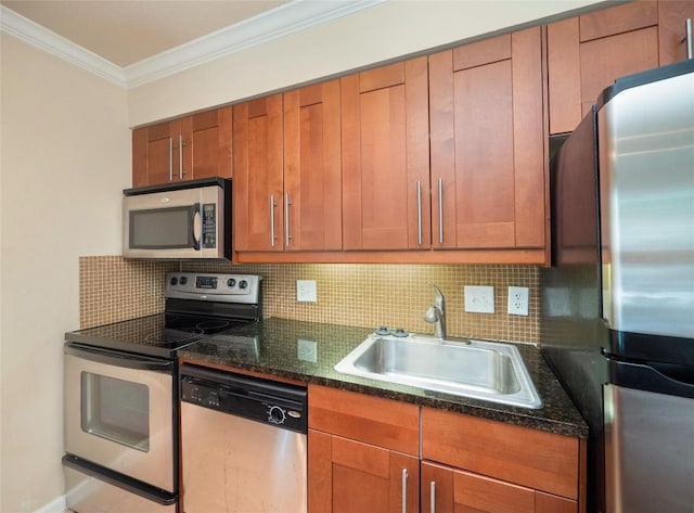 kitchen featuring appliances with stainless steel finishes, backsplash, a sink, and crown molding