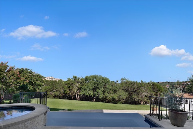 view of pool featuring a yard