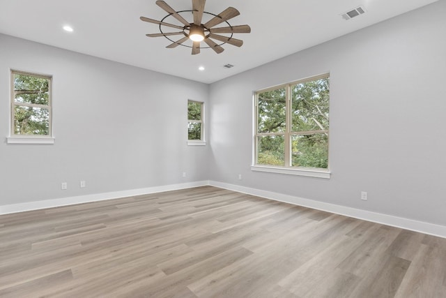 unfurnished room featuring ceiling fan and light hardwood / wood-style flooring