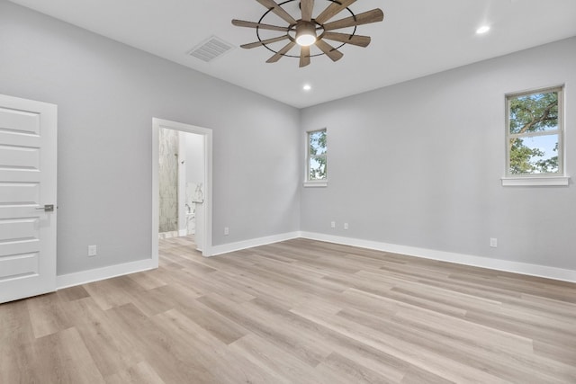 unfurnished room with light hardwood / wood-style flooring and ceiling fan