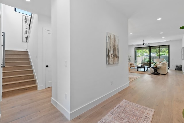 hall with light hardwood / wood-style floors