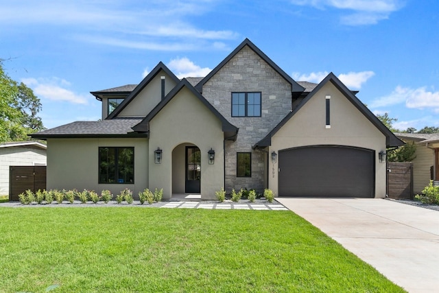 view of front of home featuring a garage and a front yard