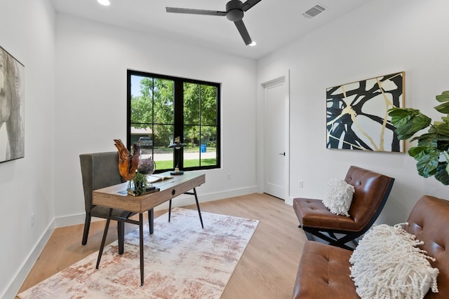 office area with ceiling fan and light hardwood / wood-style floors