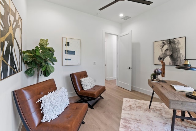 office space with ceiling fan and light wood-type flooring